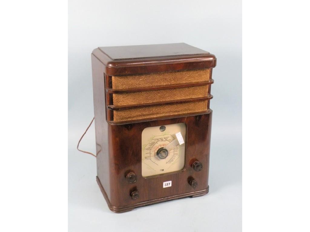 Appraisal: A defiant Co-op radio in a walnut case with bakelite