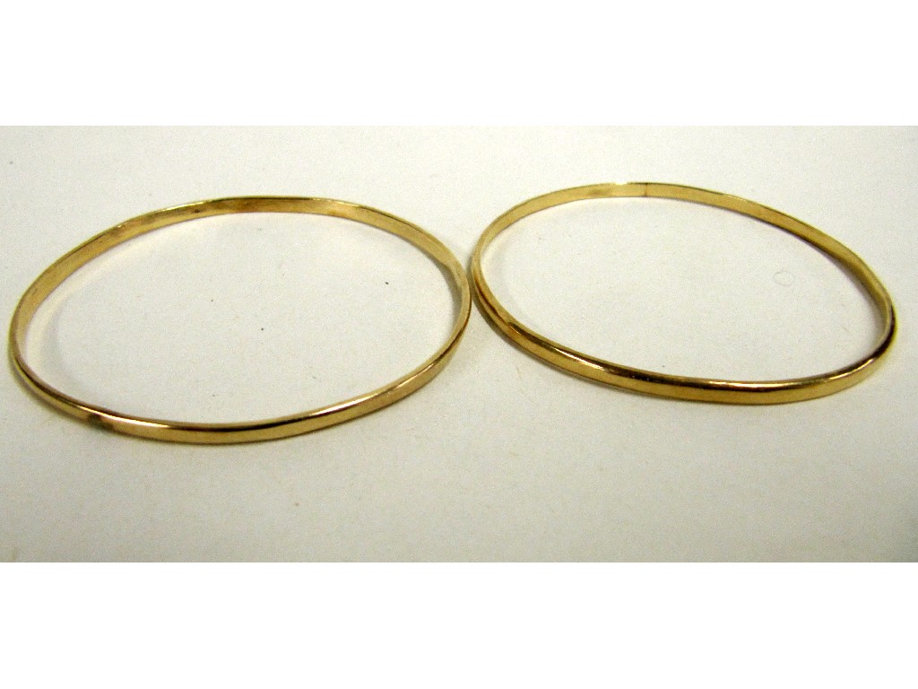 Appraisal: Two yellow metal bangles tests for ct Approx gms