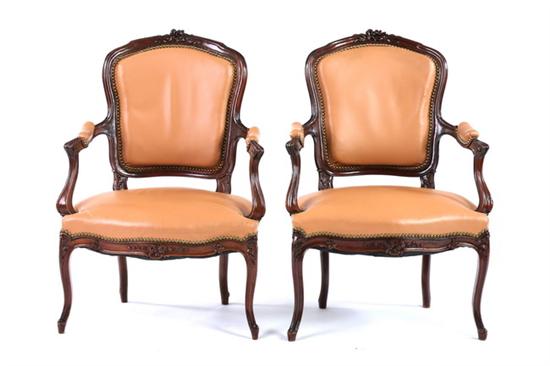 Appraisal: PAIR LOUIS XV STYLE CARVED FRUITWOOD FAUTEUILS EN CABRIOLE early