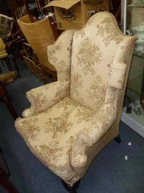 Appraisal: A GEORGIAN STYLE WING BACK ARMCHAIR wide