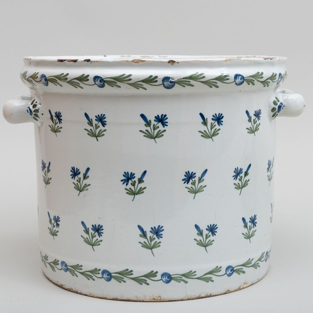 Appraisal: Continental Faience Orange Tub Decorated with Blue Flowers x in