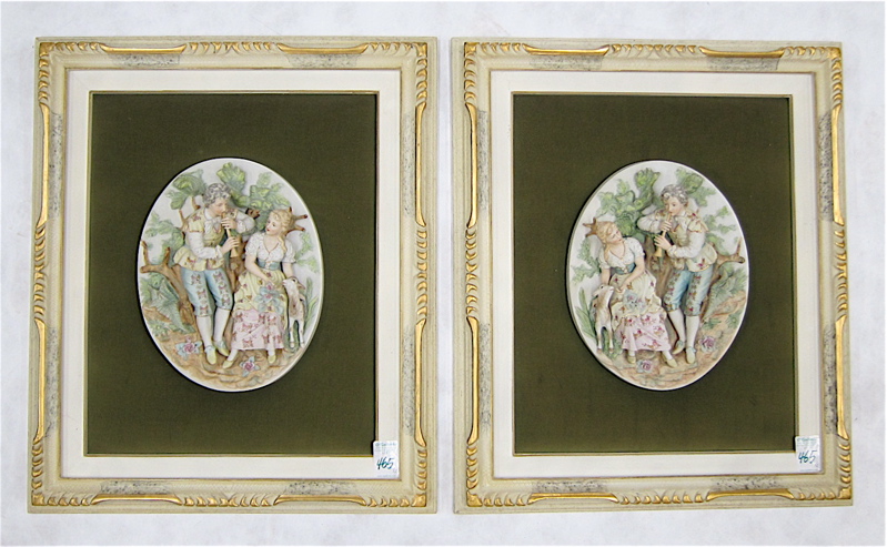 Appraisal: A PAIR OF PAINTED BISQUE PORCELAIN RELIEF WALL PLAQUES each