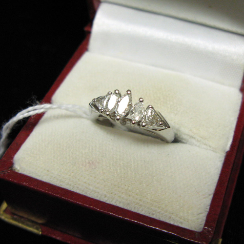 Appraisal: DIAMOND AND FOURTEEN KARAT WHITE GOLD RING with a row