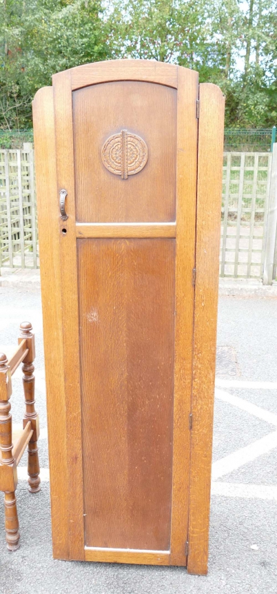 Appraisal: Slim double panelled single door wardrobe with floral carving