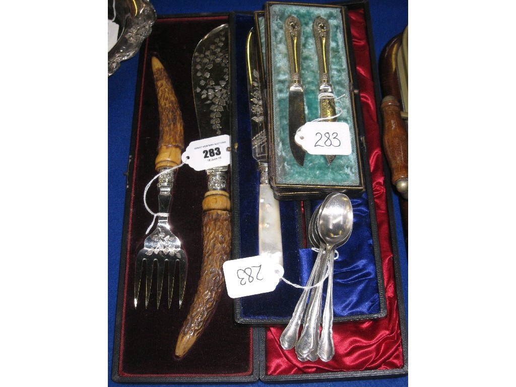 Appraisal: Lot comprising cased fish servers cake knife pair of knives