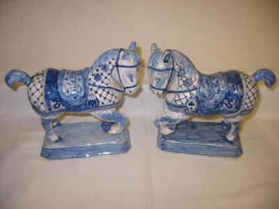 Appraisal: A PAIR OF CONTINENTAL DELFT HORSES modelled cantering in full