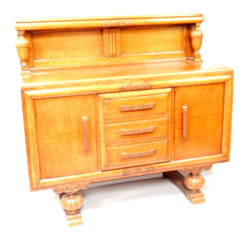 Appraisal: A s oak sideboard having galleried back with urn shaped