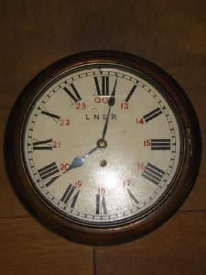 Appraisal: An LNER wall clock with single train movement circular mahogany