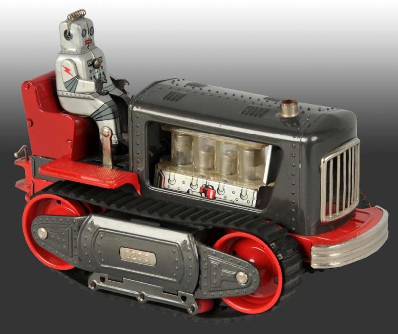 Appraisal: Robot Tractor Battery-Operated Toy Description Japanese Working Original silver robot