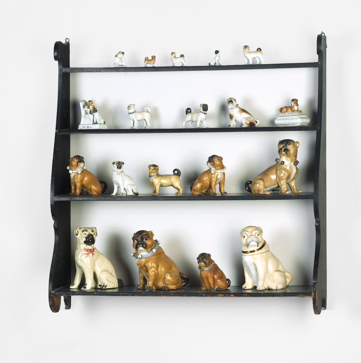 Appraisal: SEVENTEEN POTTERY AND PORCELAIN FIGURES OF PUG DOGS INCLUDING JARS