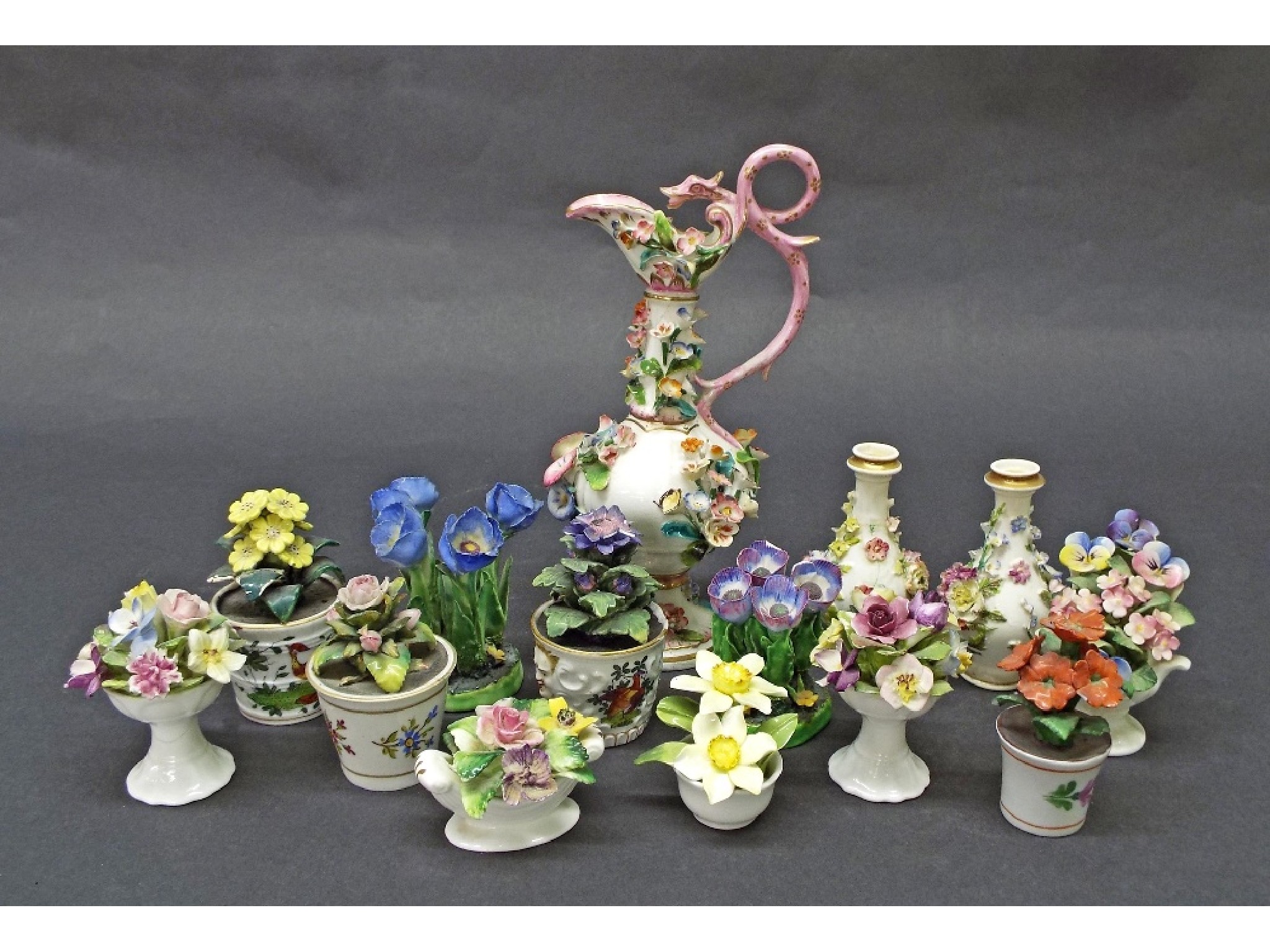 Appraisal: Collection of fourteen floral porcelain studies to include encrusted vases