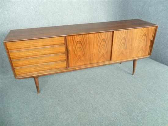 Appraisal: OMANN JUN manufacturer A DANISH ROSEWOOD SIDEBOARD with four drawers