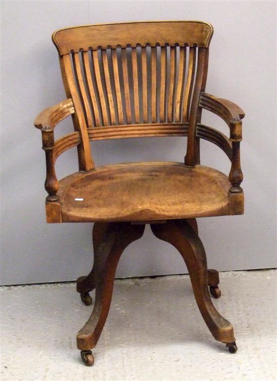 Appraisal: Early th century elm rail back office chair