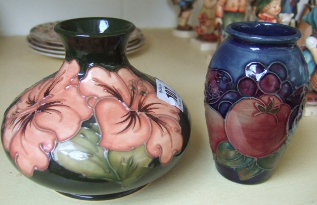 Appraisal: A Moorcroft small 'pomegranate' vase and a squat 'peony' pattern