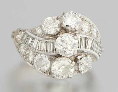 Appraisal: A Ladies' Platinum and Diamond Cluster Ring A beautiful diamond