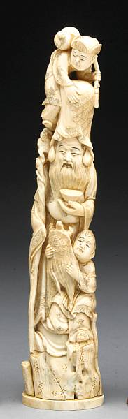 Appraisal: A carved and tinted ivory figural group of Fukurokuju and