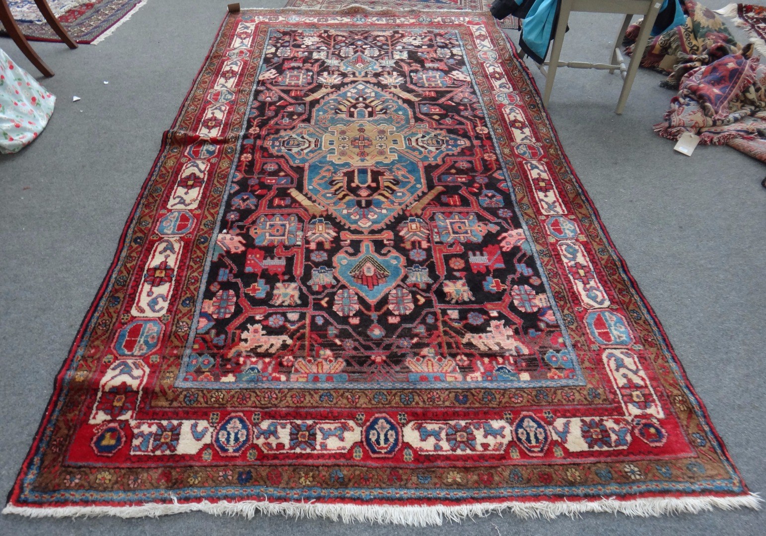 Appraisal: A Bakhtiari rug Persian the black field with a bold