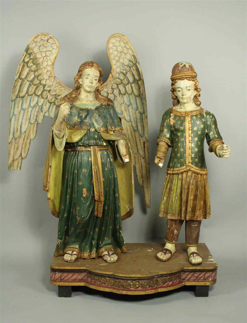 Appraisal: PAIR OF LARGE CONTINENTAL POLYCHROME AND CARVED WOOD FIGURES one