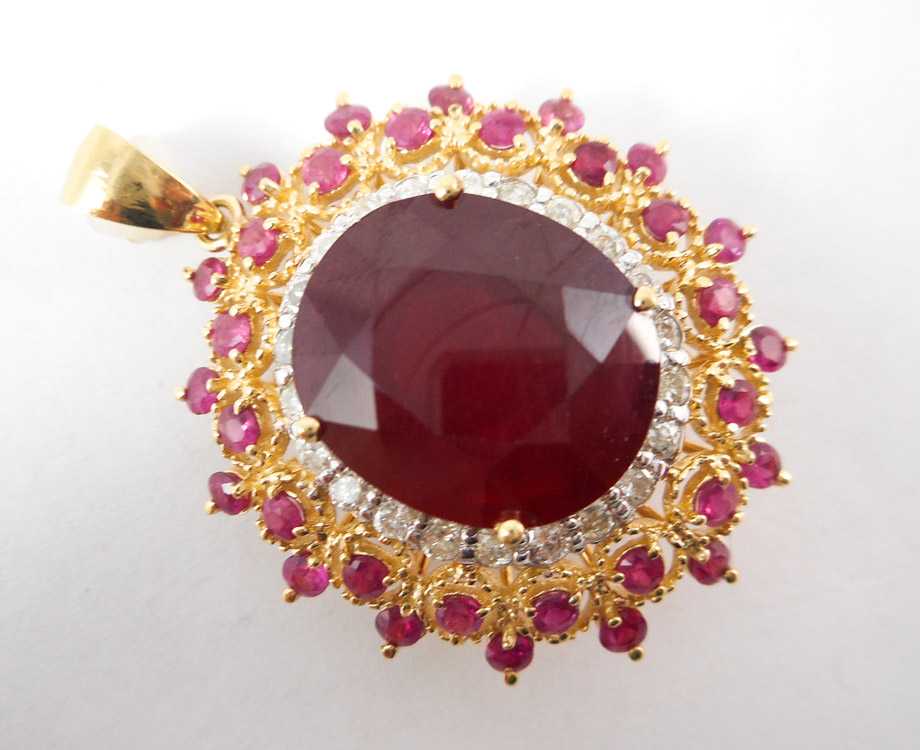 Appraisal: RUBY DIAMOND AND FOURTEEN KARAT GOLD PENDANT with round-cut rubies