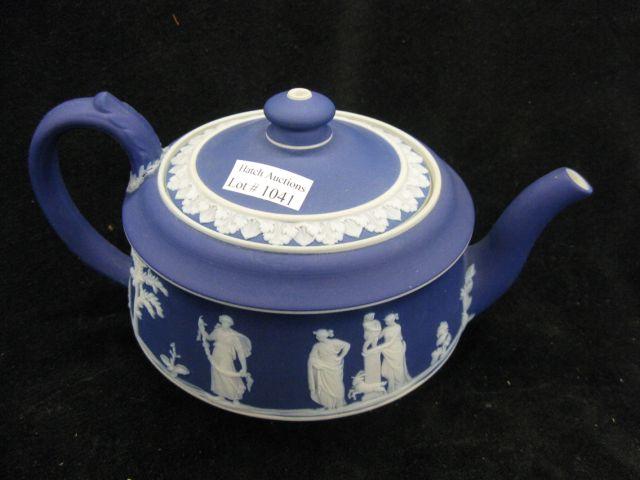 Appraisal: Wedgwood Dark Blue Jasperware Teapot classical maiden cherub scenes diameter