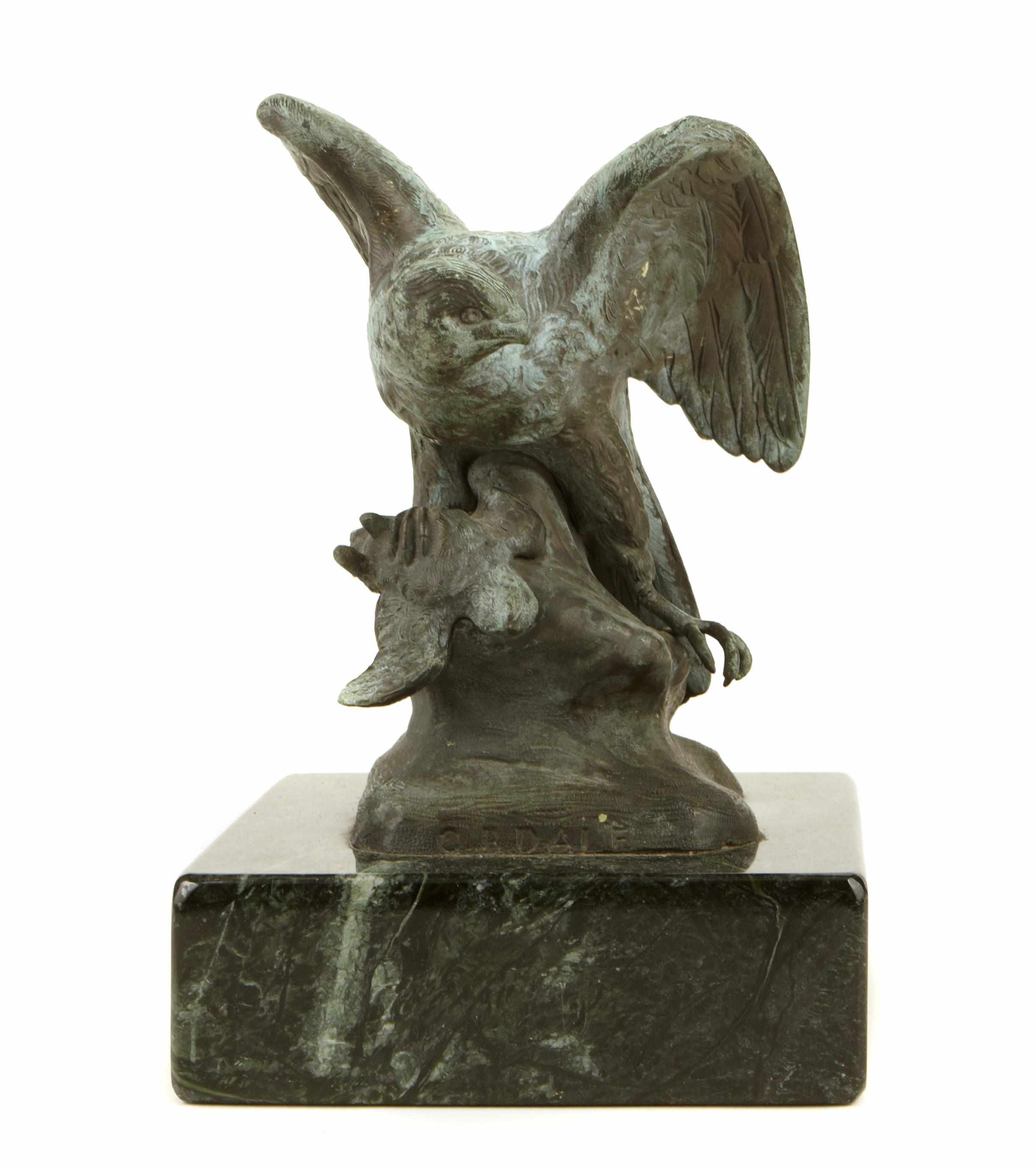 Appraisal: A patinated bronze depicting a falcon and prey on rocky