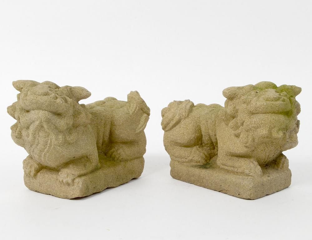 Appraisal: PAIR OF CARVED SANDSTONE FU-DOGS Modern In a Chinese style