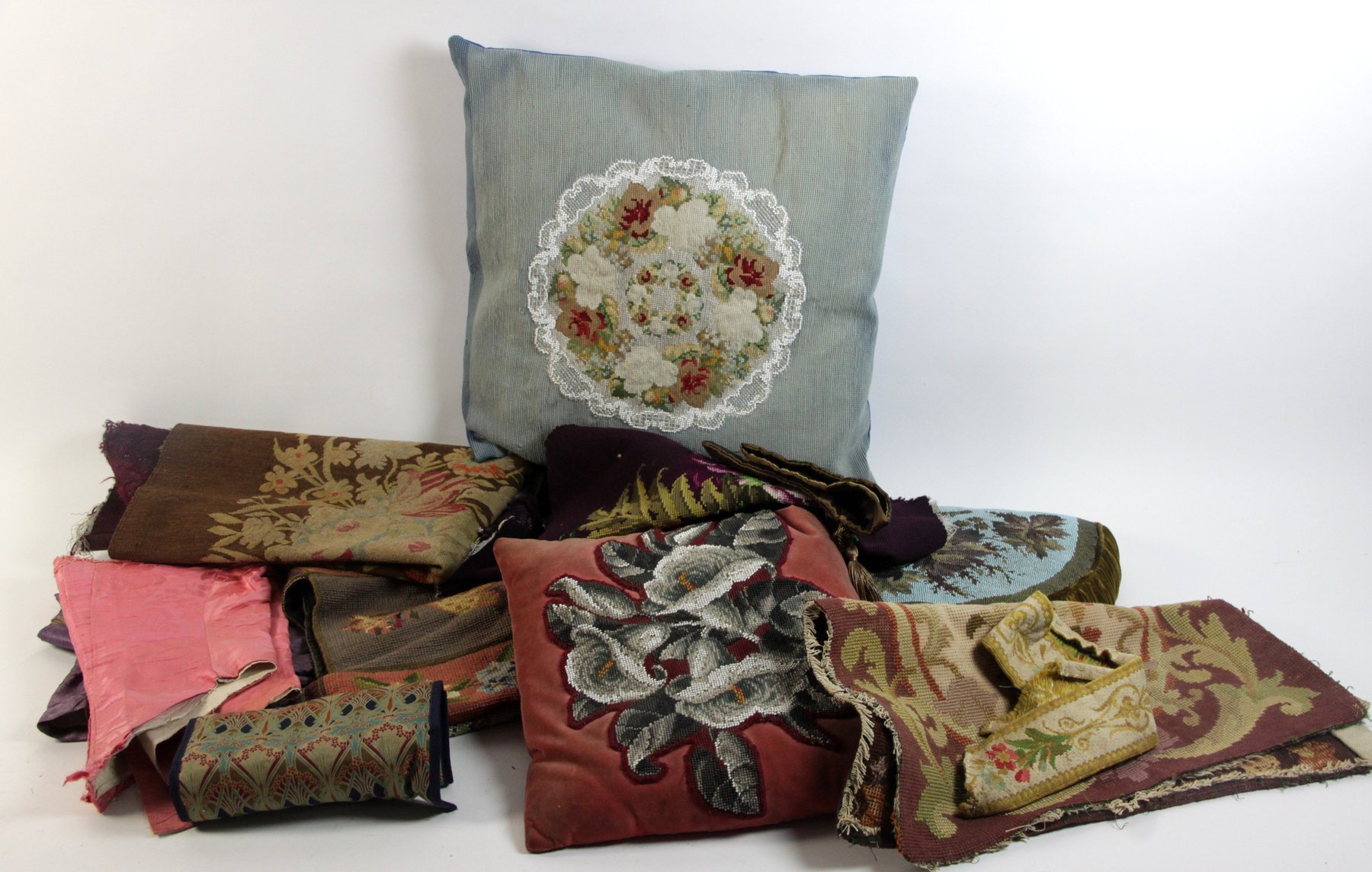 Appraisal: A quantity of needlework cushion panels and other textiles two