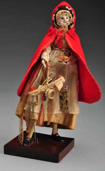 Appraisal: Rare Early English Peddler Doll Description With her C H