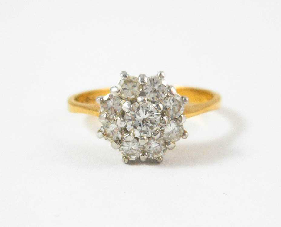 Appraisal: DIAMOND AND EIGHTEEN KARAT GOLD RING The white and yellow