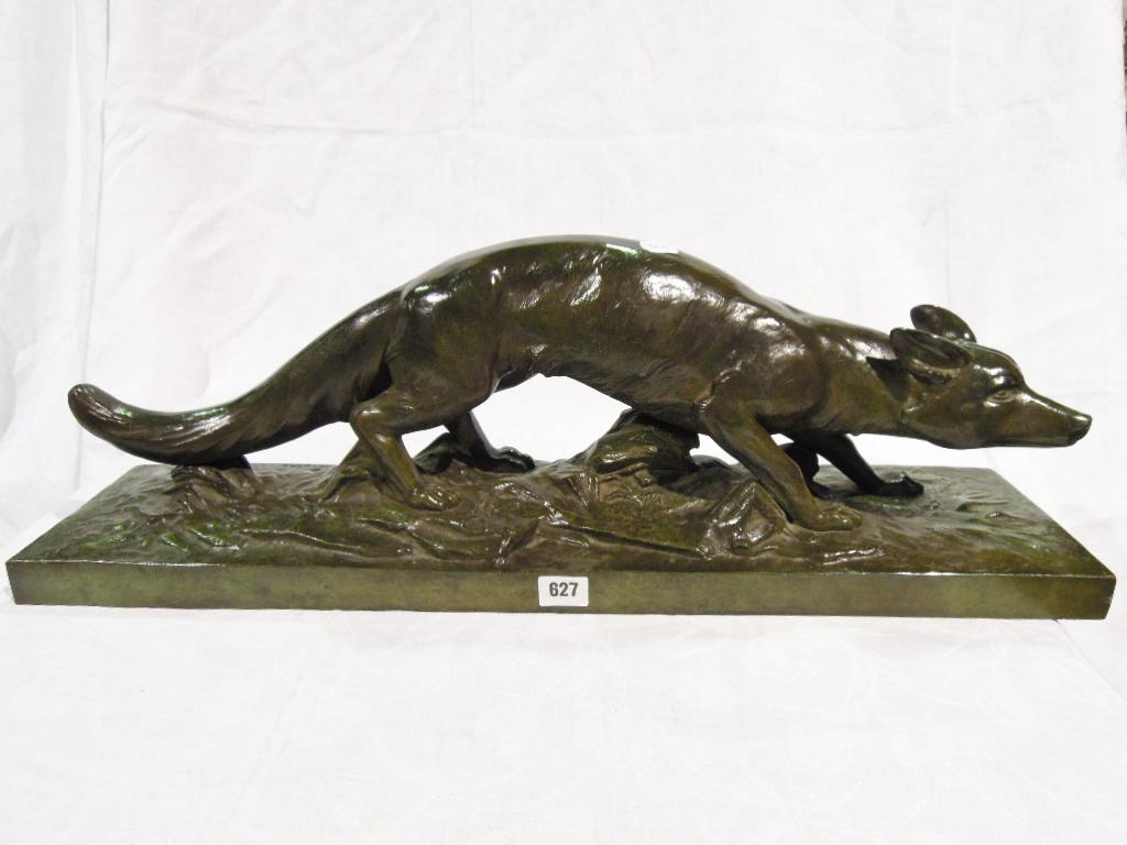 Appraisal: A bronze statue of a fox in a verdigris finish