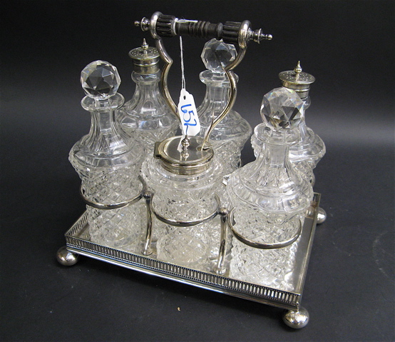 Appraisal: ENGLISH VICTORIAN SIX-BOTTLE CASTOR SET c each clear glass bottle