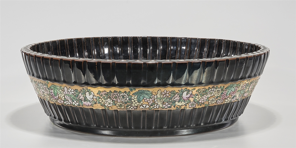 Appraisal: Chinese black glazed porcelain basin famille rose central band bamboo-form