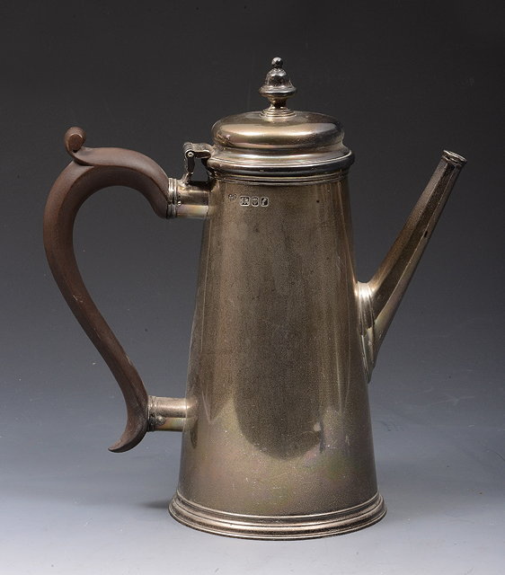 Appraisal: A SILVER COFFEE POT with plain tapering body domed hinged