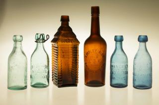 Appraisal: Six Western Bottles Six assorted Western glass bottles comprising a