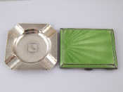 Appraisal: Silver A lady's Art Deco cigarette case the front green