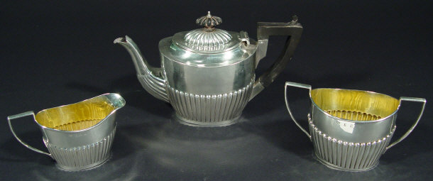 Appraisal: Edwardian three piece silver bachelor's tea set the teapot with