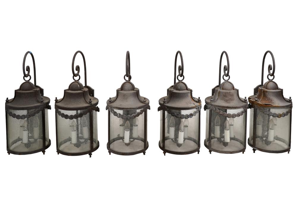 Appraisal: SIX IRON GLASS WALL LANTERNSeach with three lights Condition metal