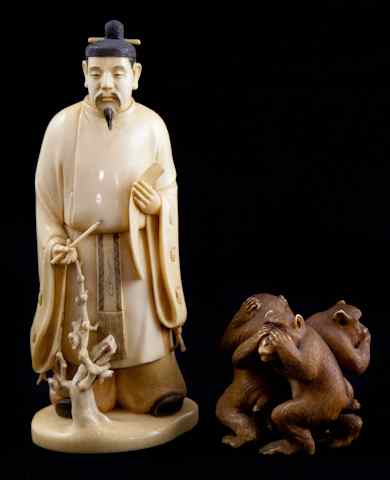 Appraisal: TWO JAPANESE IVORY OKIMONO the first well carved as a