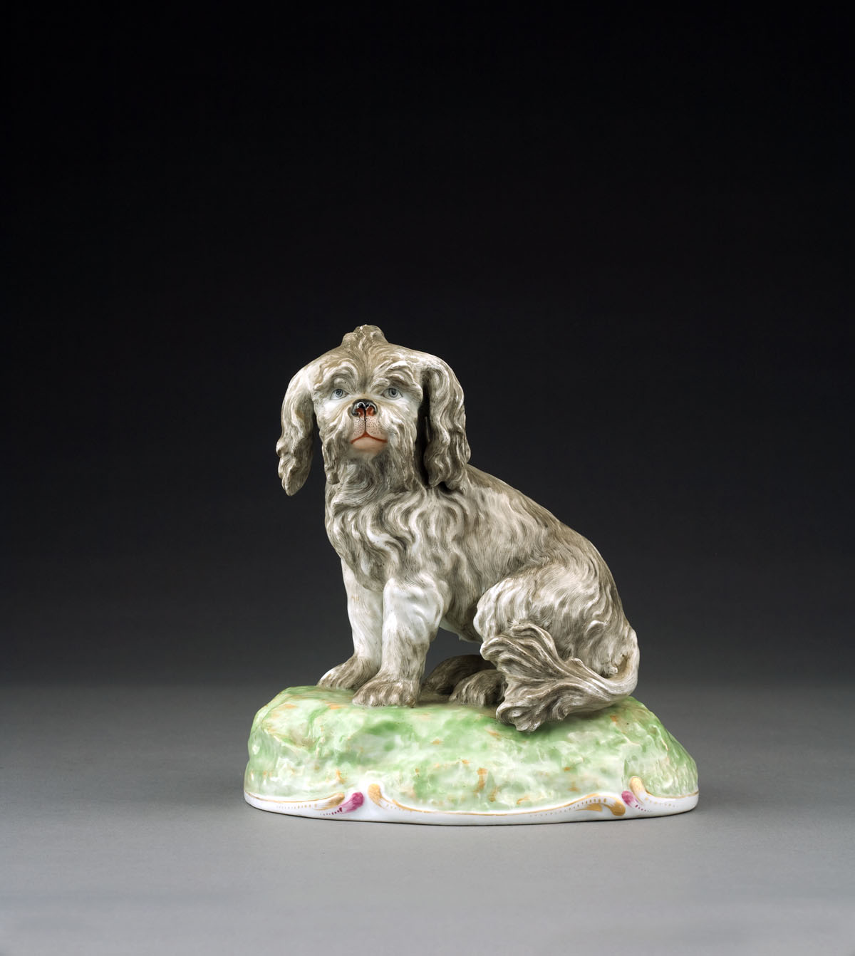 Appraisal: GERMAN PORCELAIN FIGURE OF A SEATED BOLOGNESE DOG PROBABLY NYMPHENBURG