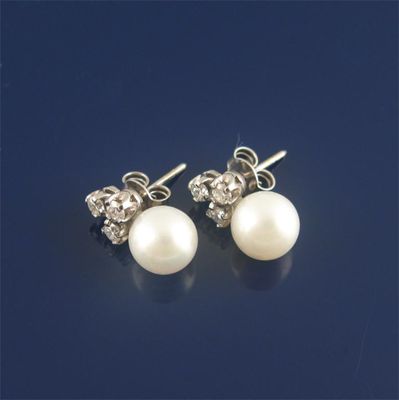 Appraisal: A pair of cultured pearl and diamond earrings the single