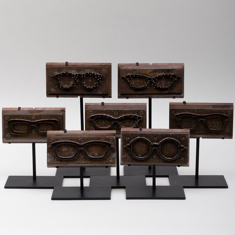 Appraisal: Group of Seven Metal Eye-Glass Molds Raised on stands The