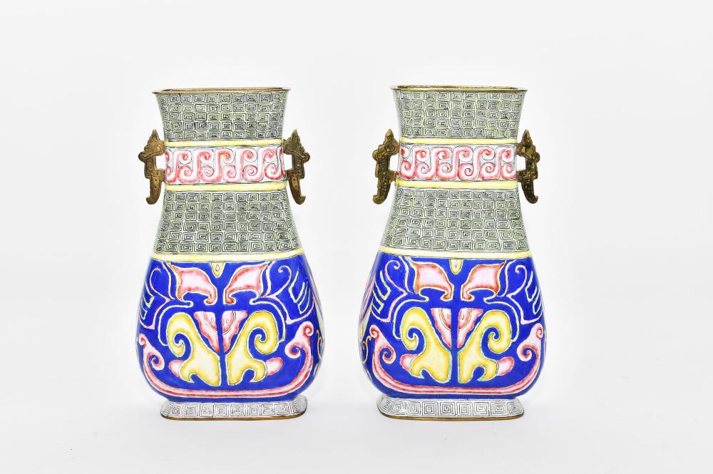 Appraisal: PAIR OF CHINESE POLYCHROME ENAMEL ON COPPER VASESEach flattened baluster