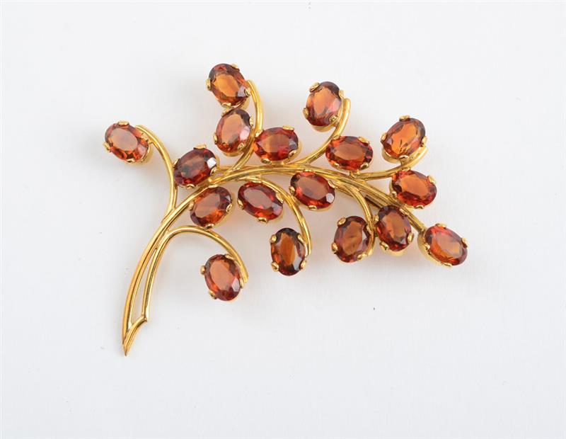 Appraisal: RETRO K GOLD AND CITRINE FLORAL PIN With oval madeira