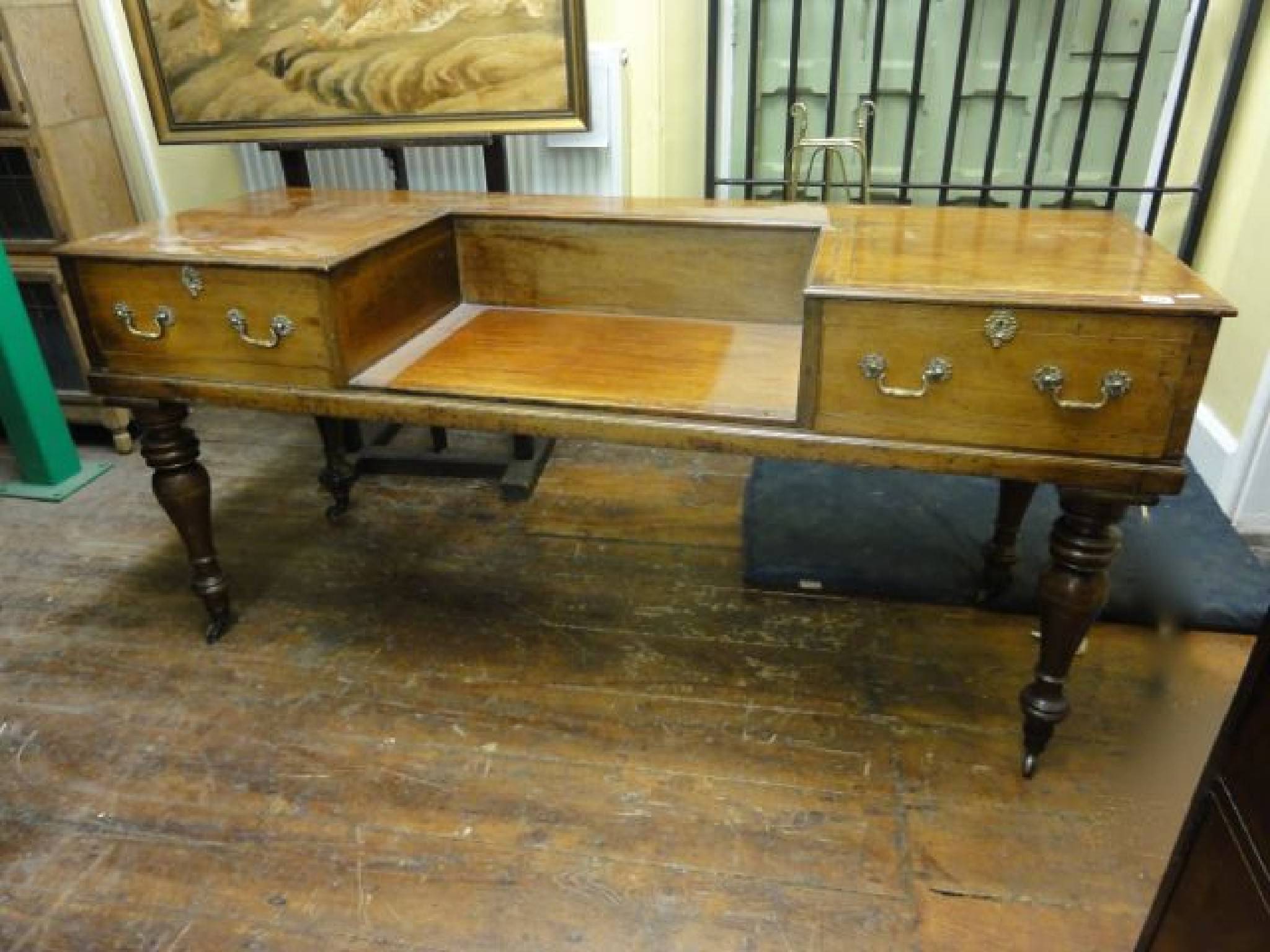 Appraisal: An early th century mahogany sideboard dressing table enclosing two