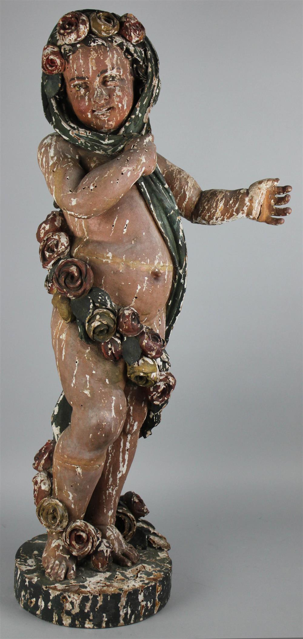 Appraisal: POLYCHROME WOOD FIGURE OF A PUTTO PROBABLY ITALIAN LATE TH