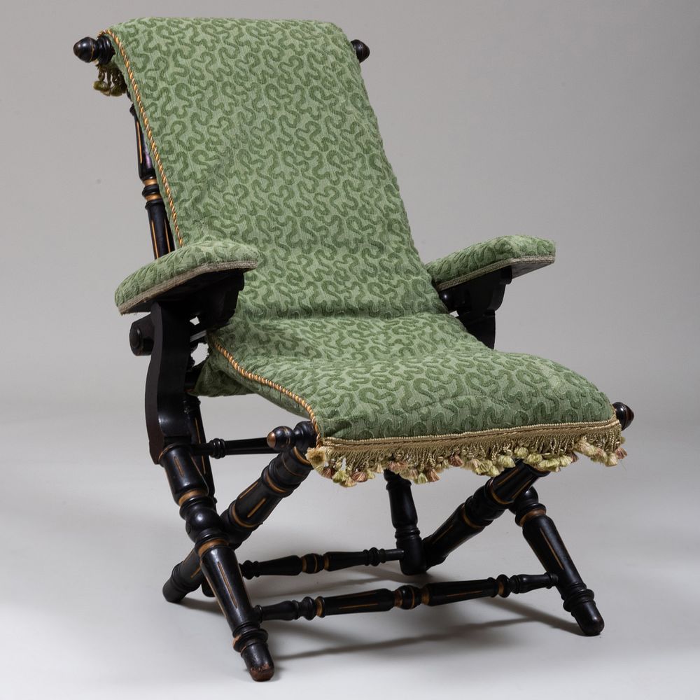 Appraisal: Renaissance Revival Ebonized Parcel-Gilt and Upholstered Folding-Reclining Arm Chair Stamped