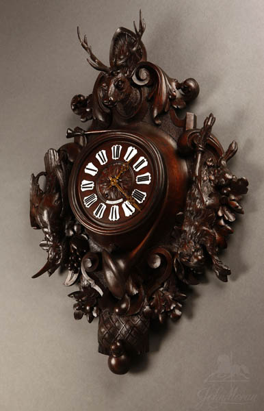 Appraisal: French carved walnut hunting trophy cartel clock French carved walnut