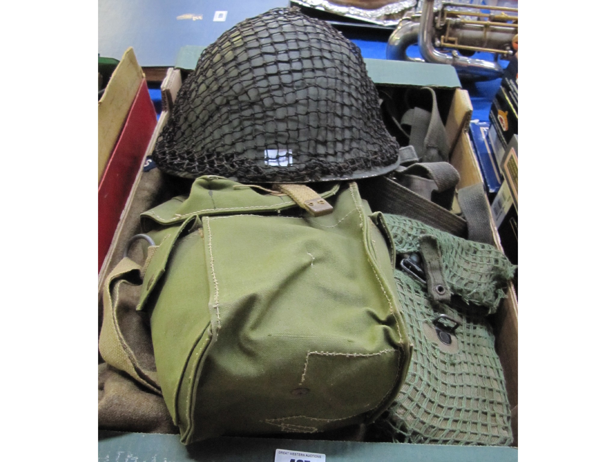 Appraisal: A lot comprising military helmet water bottle cartridge pouch webbing