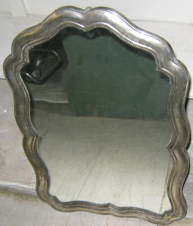 Appraisal: SILVER FRAMED EASEL MIRROR Molded cartouche shaped with ovalo rim