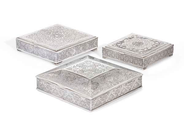 Appraisal: Three Persian silver cigarette boxes Three Persian silver cigarette boxes